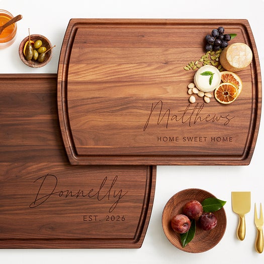 A Wooden Cutting Board with the Family Name on it