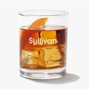 A Filled Glass Tumbler with the name 'Sullivan' on it