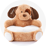 A personalized seat shaped as a brown dog with the name Taylor written on the ear