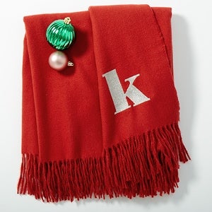 A red scarf with the letter K on it
