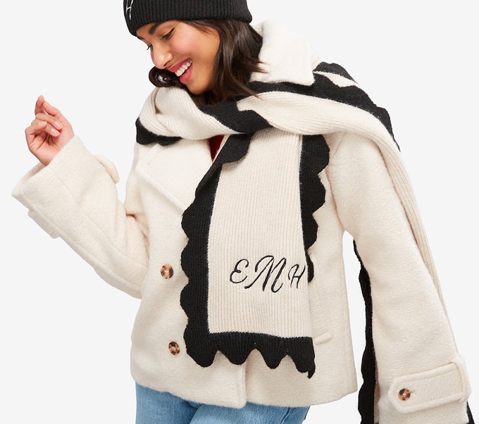 Woman wearing monogrammed scarf