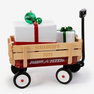 A wagon filled with gift boxes with the words Elizabeth's Toys on it