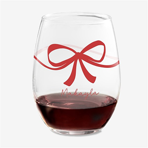 A wine glass with a red bow on it that says Makayla
