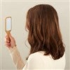 Product Thumbnail Adult Holding Mirror