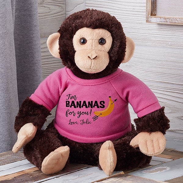 stuffed toy monkey with banana